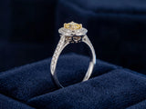 Profile view of double halo engagement ring displaying raised setting and diamond band