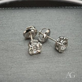 Radiant 18k white gold diamond earrings with round brilliant studs