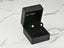 Radiant Blossom gold CZ flower earrings in a black velvet-lined jewelry box