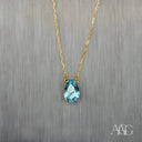 18 carat gold necklace with pear-shaped aquamarine pendant