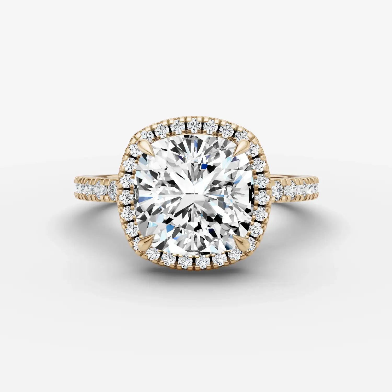 A two-tone rose gold and white gold engagement ring with a round diamond halo and pavé 18k gold fine jewelry band.