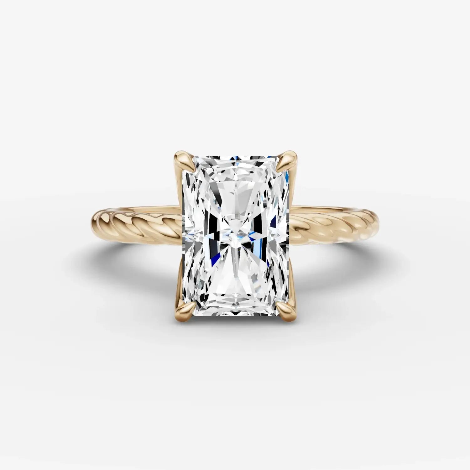 silver thimble with intricate floral engraving and central red gemstone featured in engagement rings at everett jewelry store