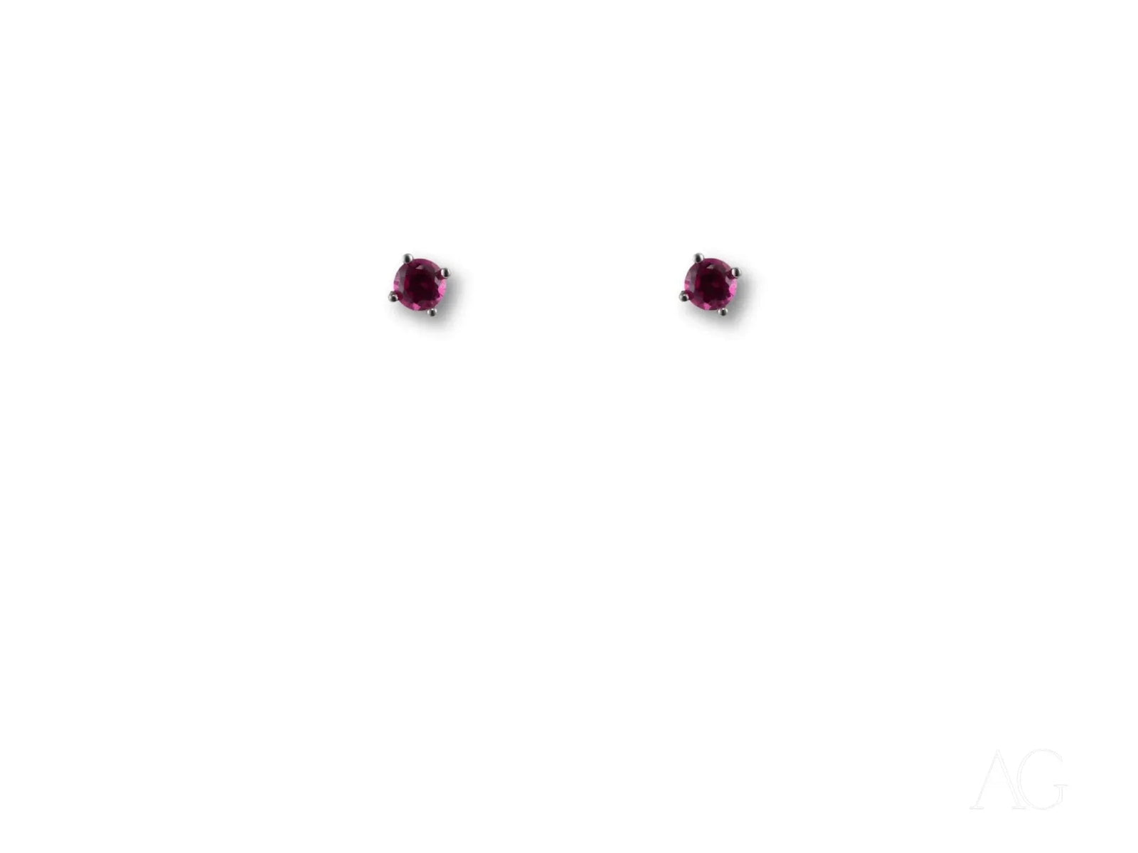 Pair of 18k white gold CZ stud earrings with dark red gemstones