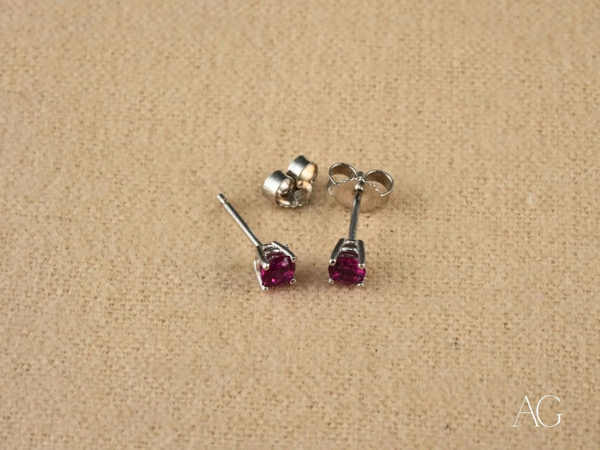 18k white gold CZ stud earrings with fuchsia round-cut gems