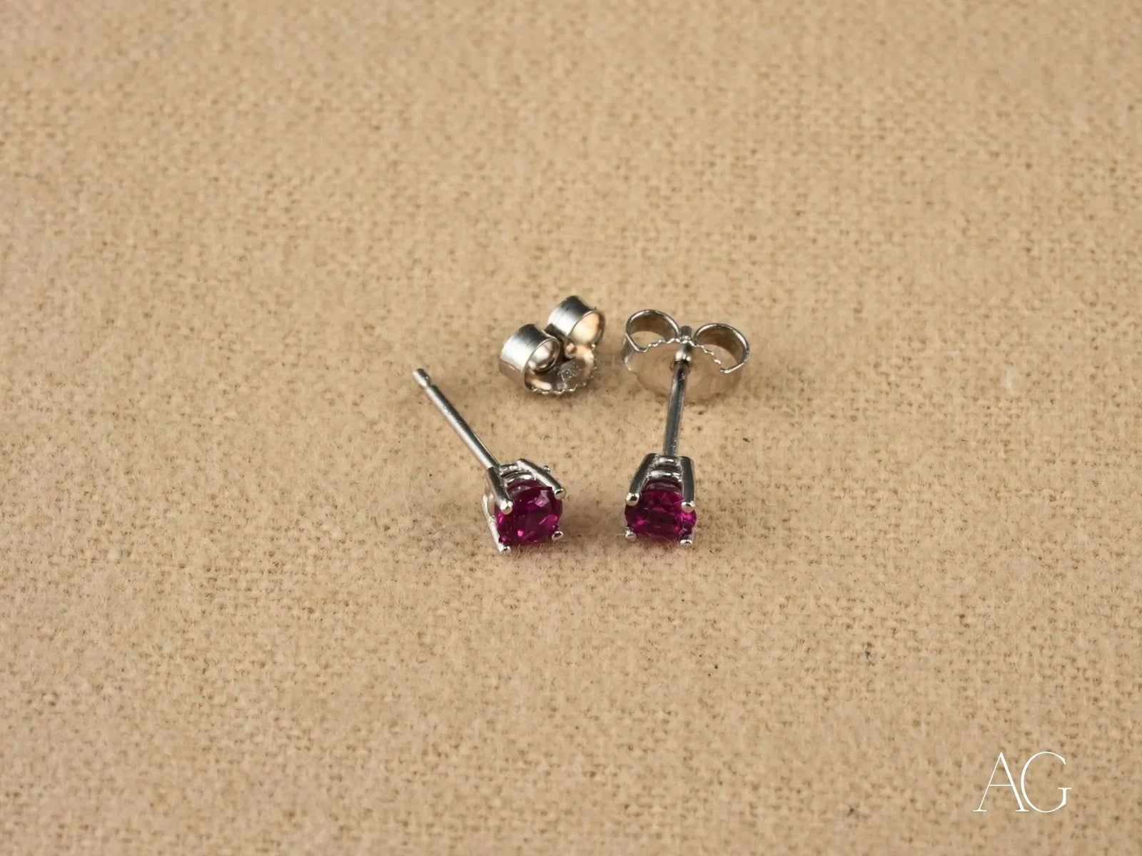 18k white gold CZ stud earrings with fuchsia round-cut gems