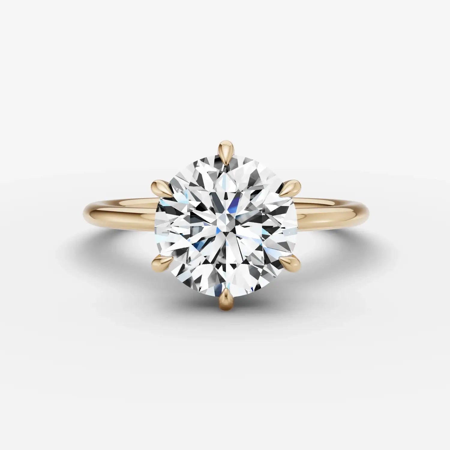 Vibrant orange and yellow faceted gemstones arranged in a radial pattern highlighting natural diamonds and lab grown options.