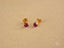Gold stud earrings with ruby-red cubic zirconia heart-shaped gemstones in high-quality 18k gold
