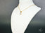Art Gold Jewelry Radiant Solitaire Pendant featuring a clear gemstone in a four-prong setting