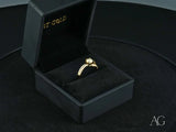 Radiant Vow engagement ring in 18k yellow gold with split shank and diamond pave band
