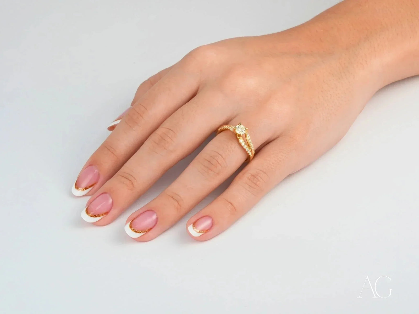 Hand with Radiant Vow Engagement Ring in 18k yellow gold, round diamond