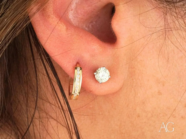 Radiate Love Mini Hoops: 18k yellow gold CZ earrings in ear