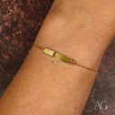 Regal elegance gold ID bracelet with crown motif