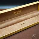 Regal elegance 18k gold ID bracelet with crown motif in jewelry box