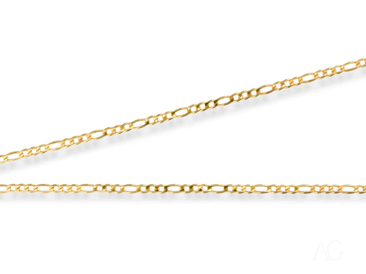 Two delicate 18K yellow gold Figaro chains in Regal Prestige art gold jewelry