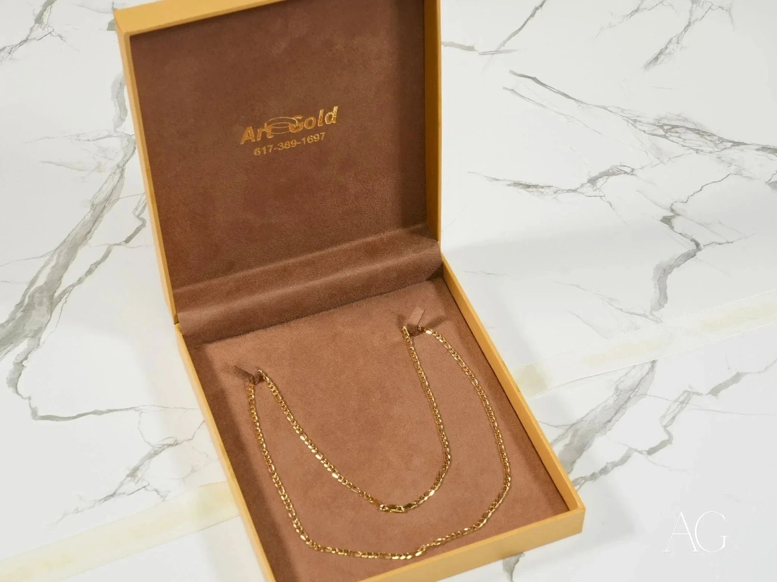Regal Prestige 18K yellow gold Figaro chain in jewelry box