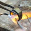 Art Gold Jewelry repair in Greater Boston Area showcasing a ring being heated with a torch