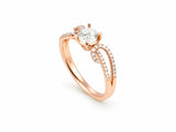 Romantic 18K rose gold diamond ring, front view of the round brilliant center diamond and the pave-set split shank