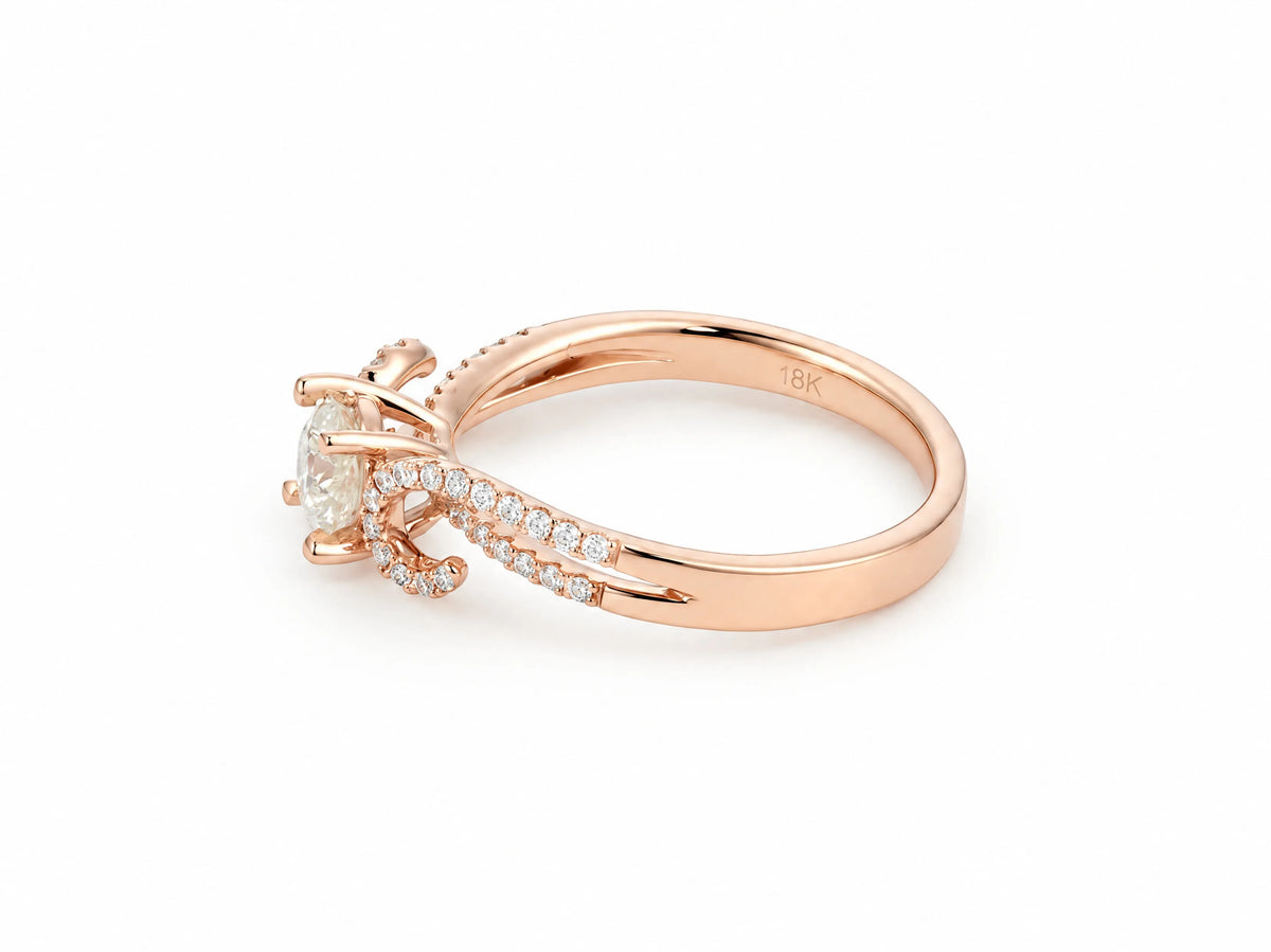 Romantic 18K rose gold diamond ring, three-quarter view showing the round brilliant center stone in four prongs and the open twisted split shank with pave-set diamonds