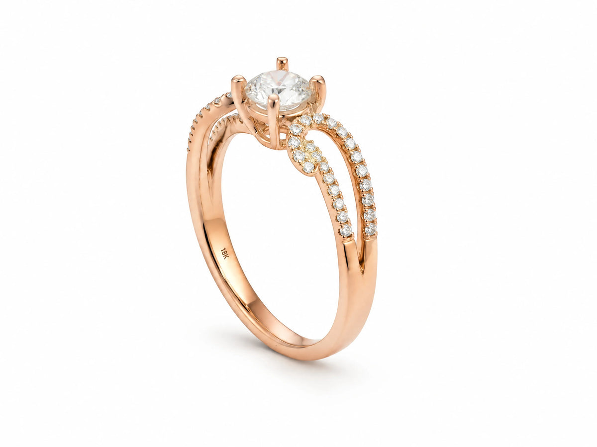 Romantic 18K rose gold diamond ring standing upright, showing the 18K hallmark engraved inside the band