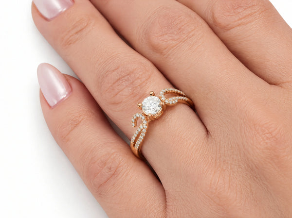 Romantic 18K rose gold diamond ring worn on the finger, close view of the center diamond and pave shoulders