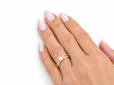 Romantic 18K rose gold diamond ring worn on the finger