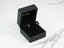 Rose stud earrings with blooming charm in a black gift box, featuring gold delicate rose design