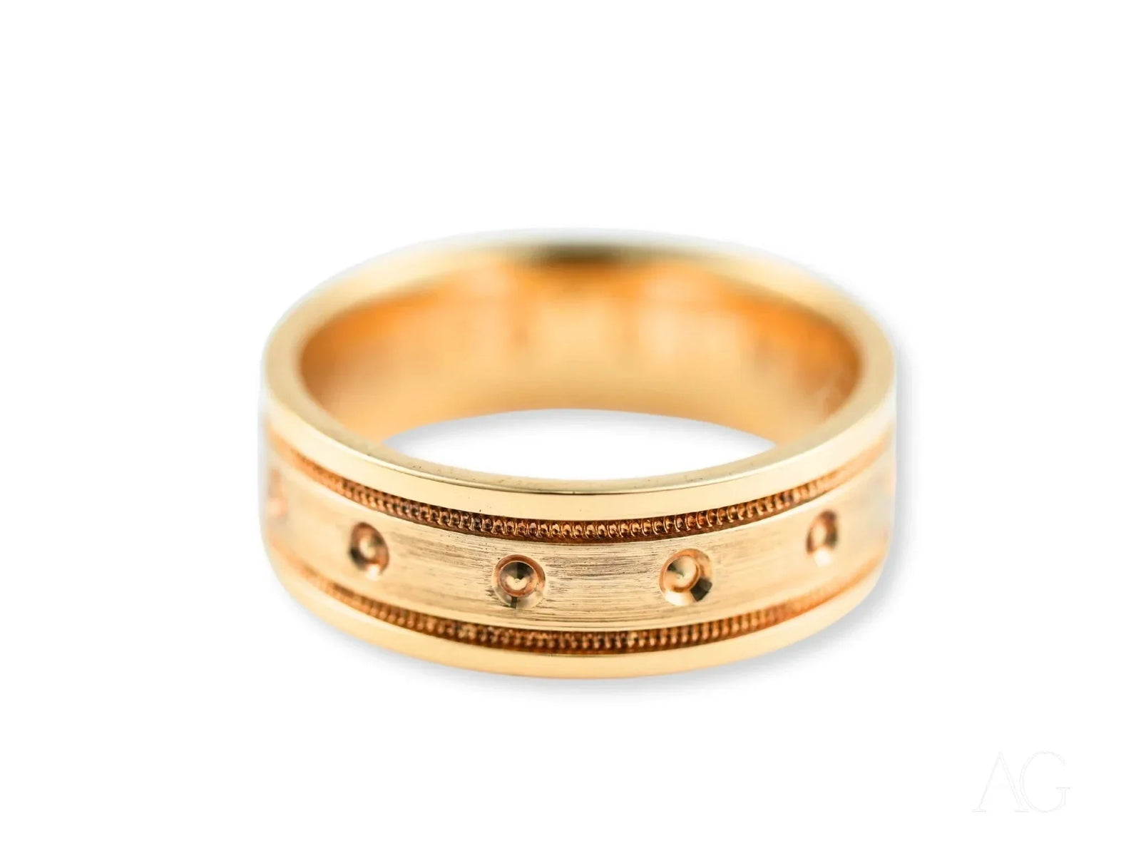 Royal Crest gold wedding band with textured accents and circular indentations
