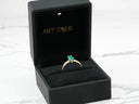 Royal Radiance 18k gold ring with emerald in black box