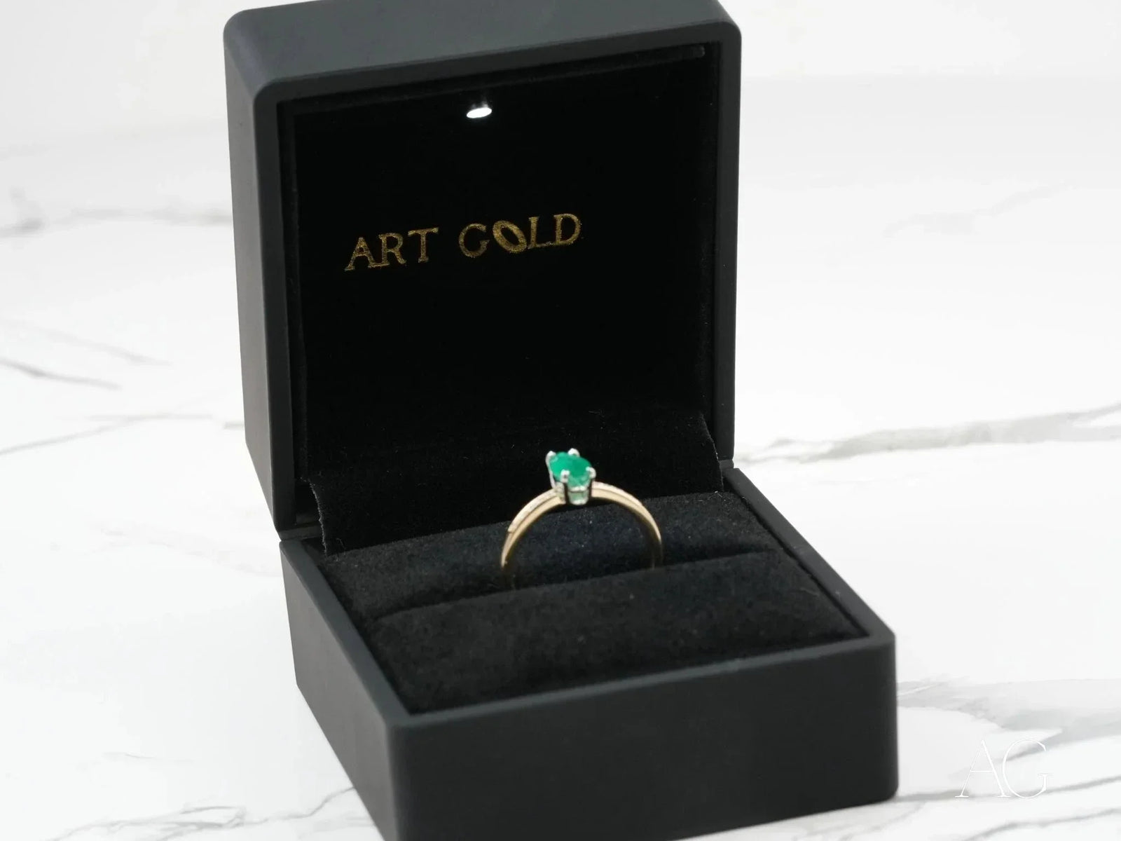 Royal Radiance 18k gold ring with emerald in black box
