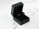 18K white gold crown earrings in open black jewelry box