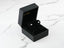 Black jewelry box with 18K white gold crown earrings featuring silver crown-shaped studs
