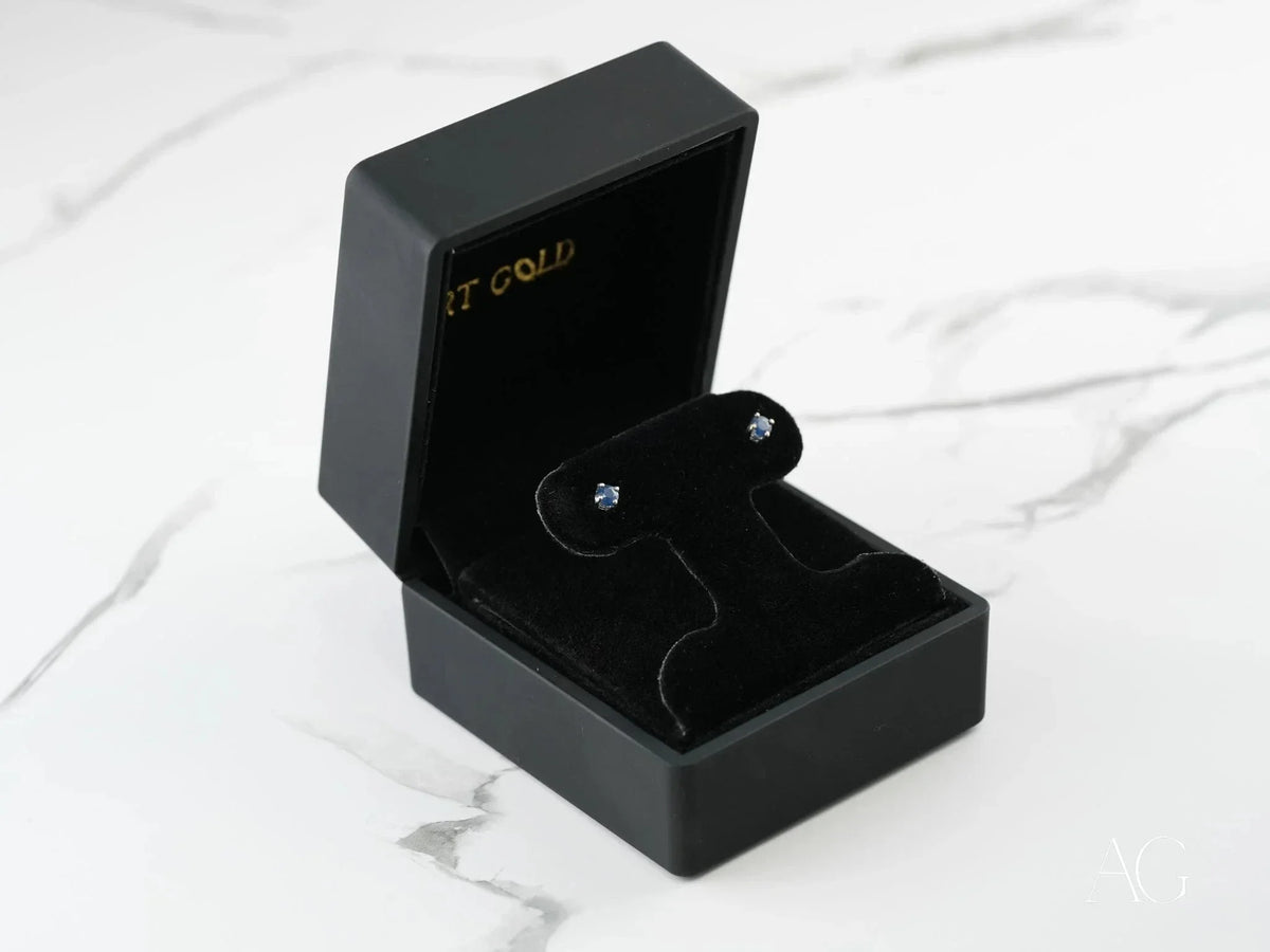 18k white gold sapphire earrings in open black velvet box