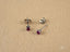 Silver stud earrings with white gold ruby gemstones from Scarlet Whispers art gold jewelry
