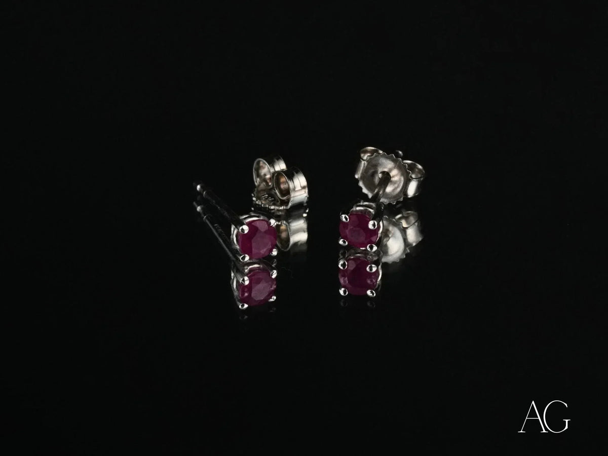 Scarlet Whispers white gold ruby stud earrings with red gems