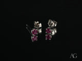 Scarlet Whispers white gold ruby stud earrings with red gems