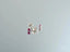 Silver stud earrings with two round-cut red gemstones from Scarlet Whispers art gold jewelry collection