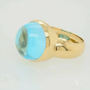 Serenity in Blue cabochon blue topaz ring with domed gemstone