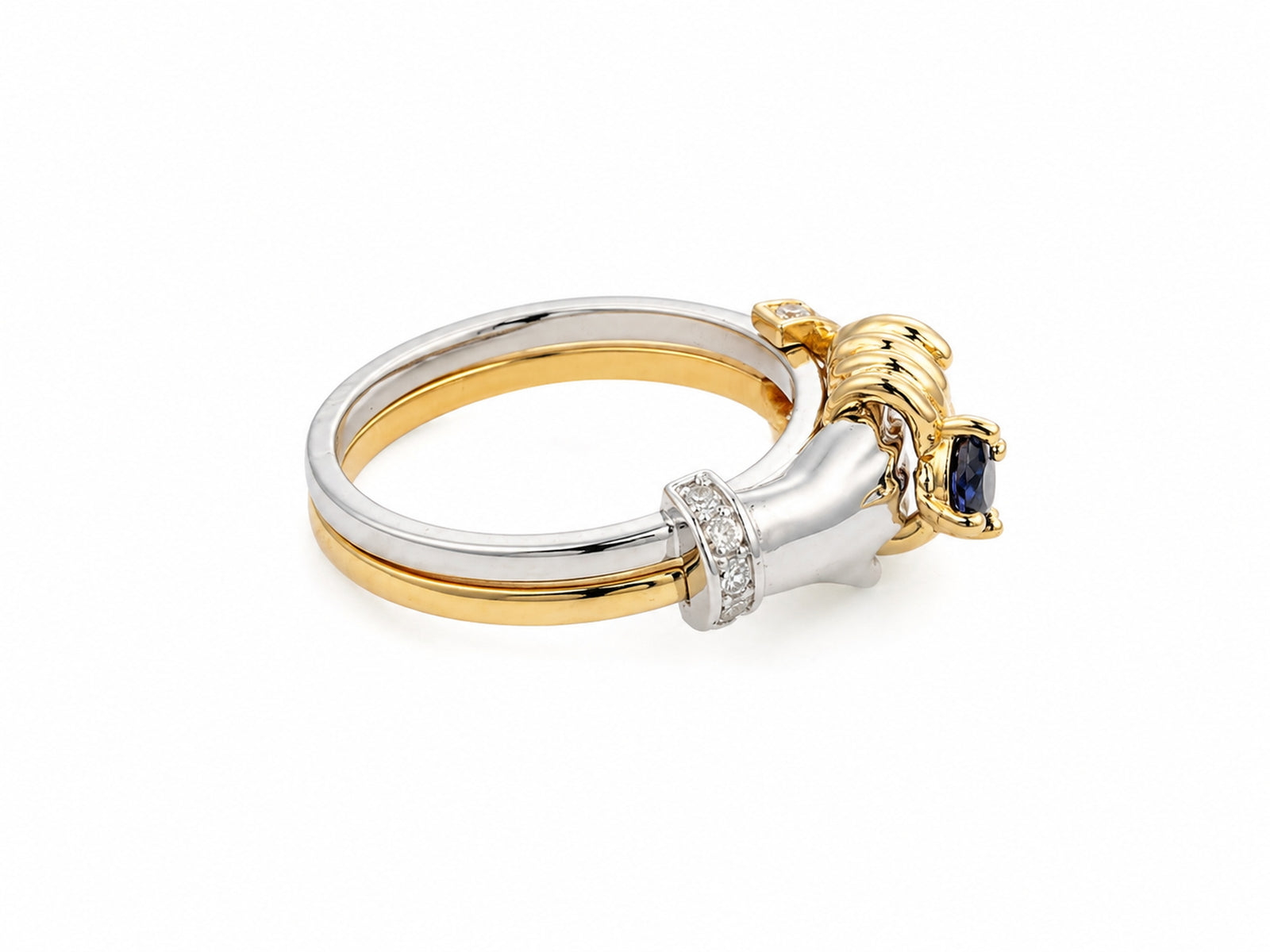 Detailed side view of sculpted hands and sapphire setting on two-tone gold band