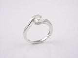 Side profile view of bypass diamond ring showing split-shank band