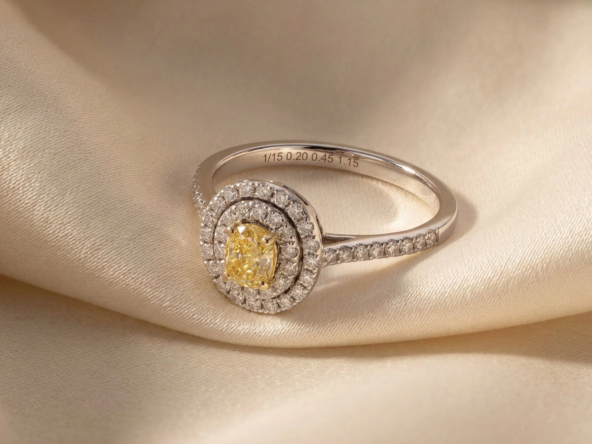 Side view of double halo engagement ring showing band profile and raised setting