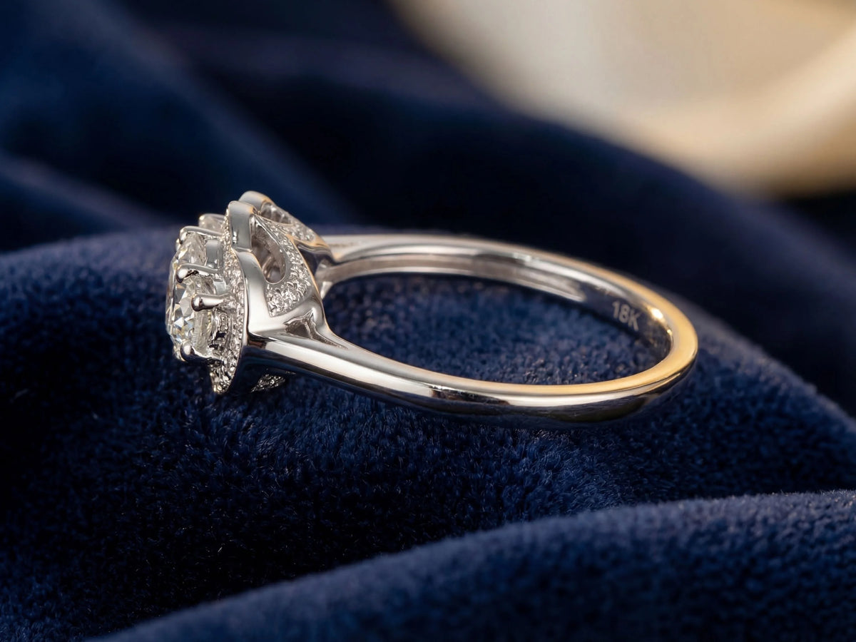 Side view of white gold three-stone diamond ring showing band profile