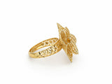 Angled side view of 18K gold flower ring displaying dimensional petals and openwork band pattern
