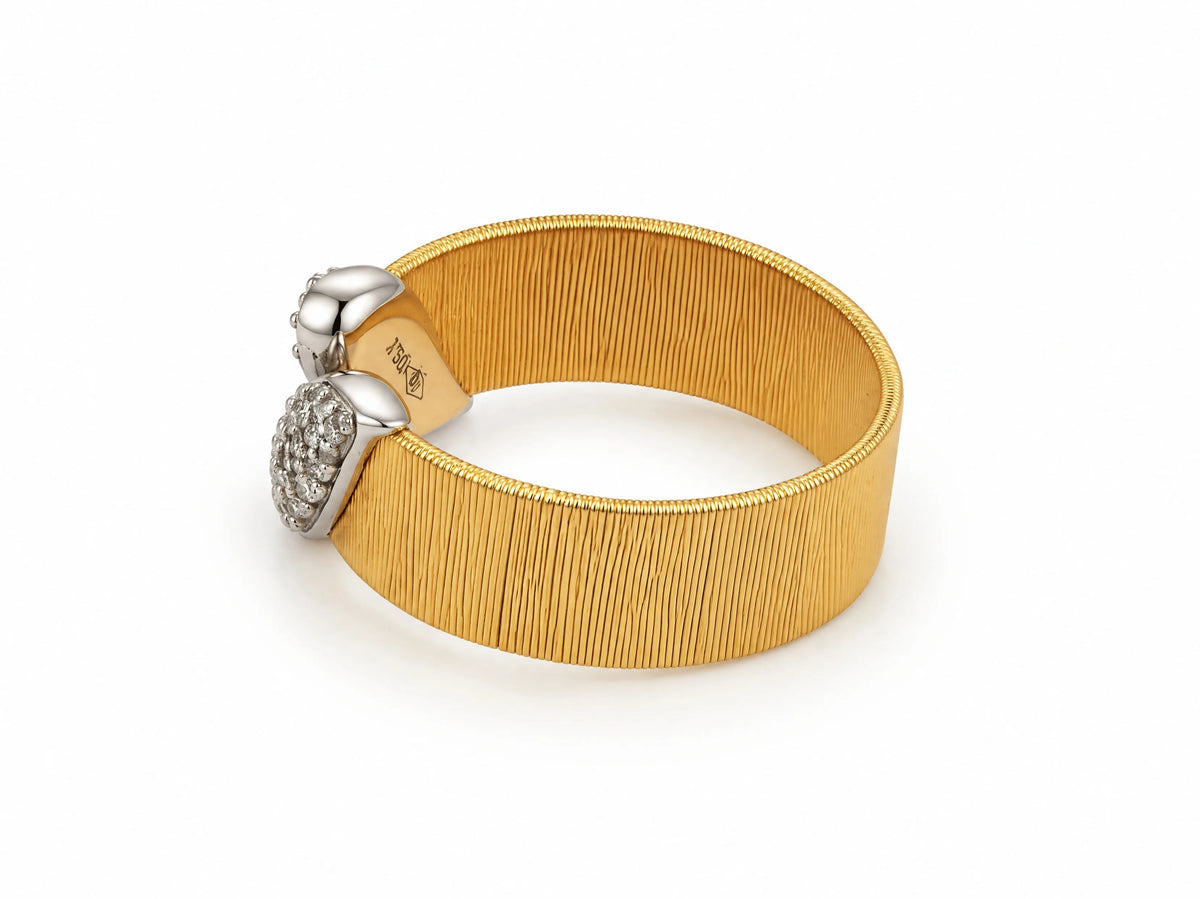 Alternate three-quarter view of the two-tone ring from the opposite side, showing the interior of the band with a visible hallmark.