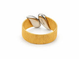 Back view of the two-tone ring showing the smooth reverse of the white gold leaves and the inner band.