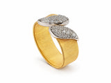 Side profile of the two-tone ring showing the brushed yellow gold band and the raised white gold leaves.