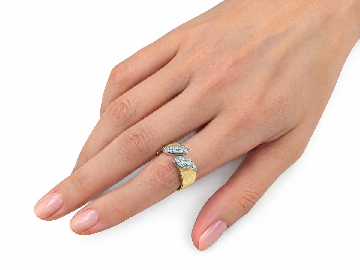 Second hand-worn view of the two-tone ring on a finger, three-quarter angle.