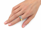 Second hand-worn view of the two-tone ring on a finger, three-quarter angle.
