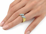 Hand-worn view of the two-tone ring on a finger, in profile, showing scale and fit.