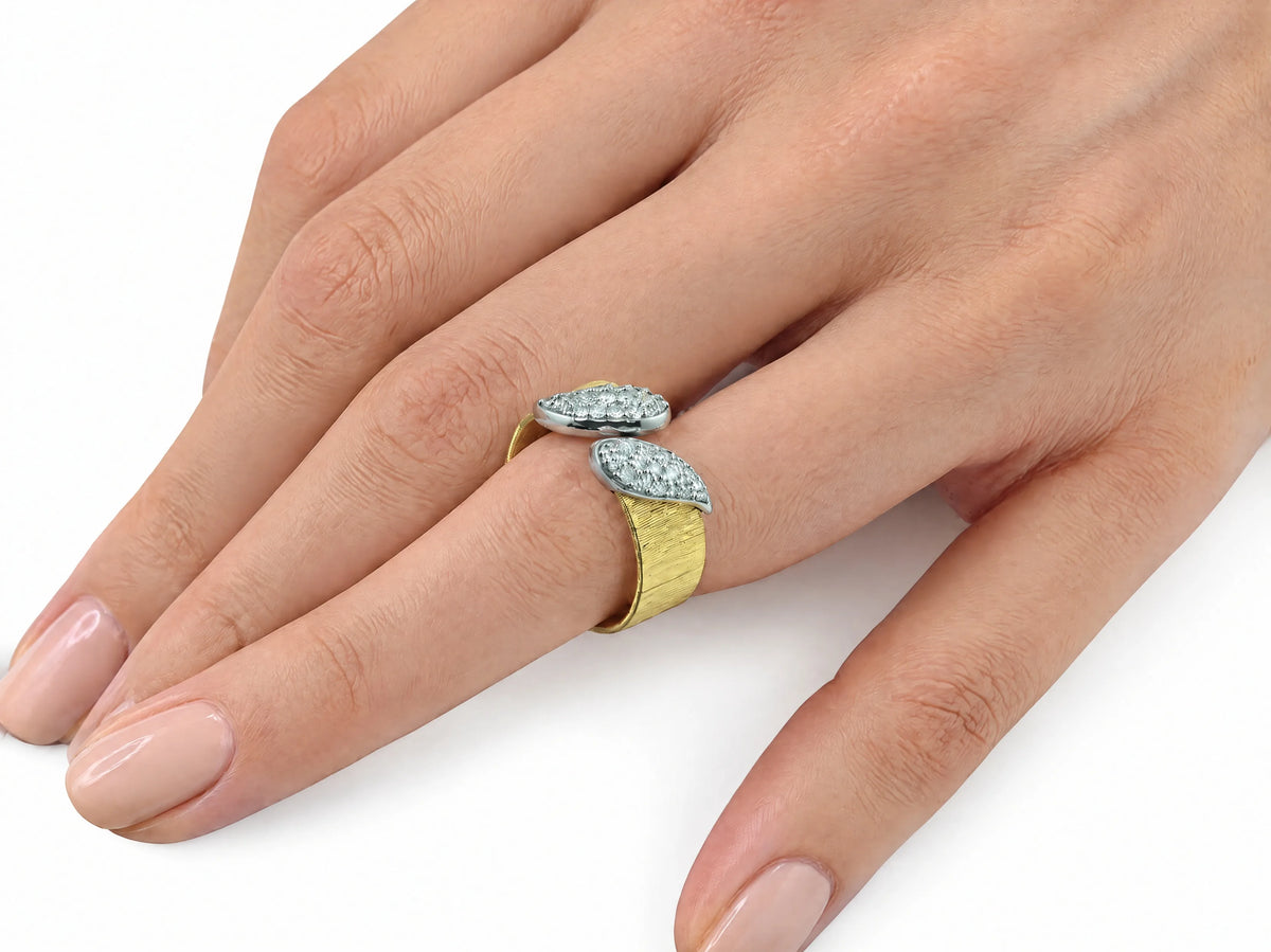 Hand-worn view of the two-tone ring on a finger, in profile, showing scale and fit.