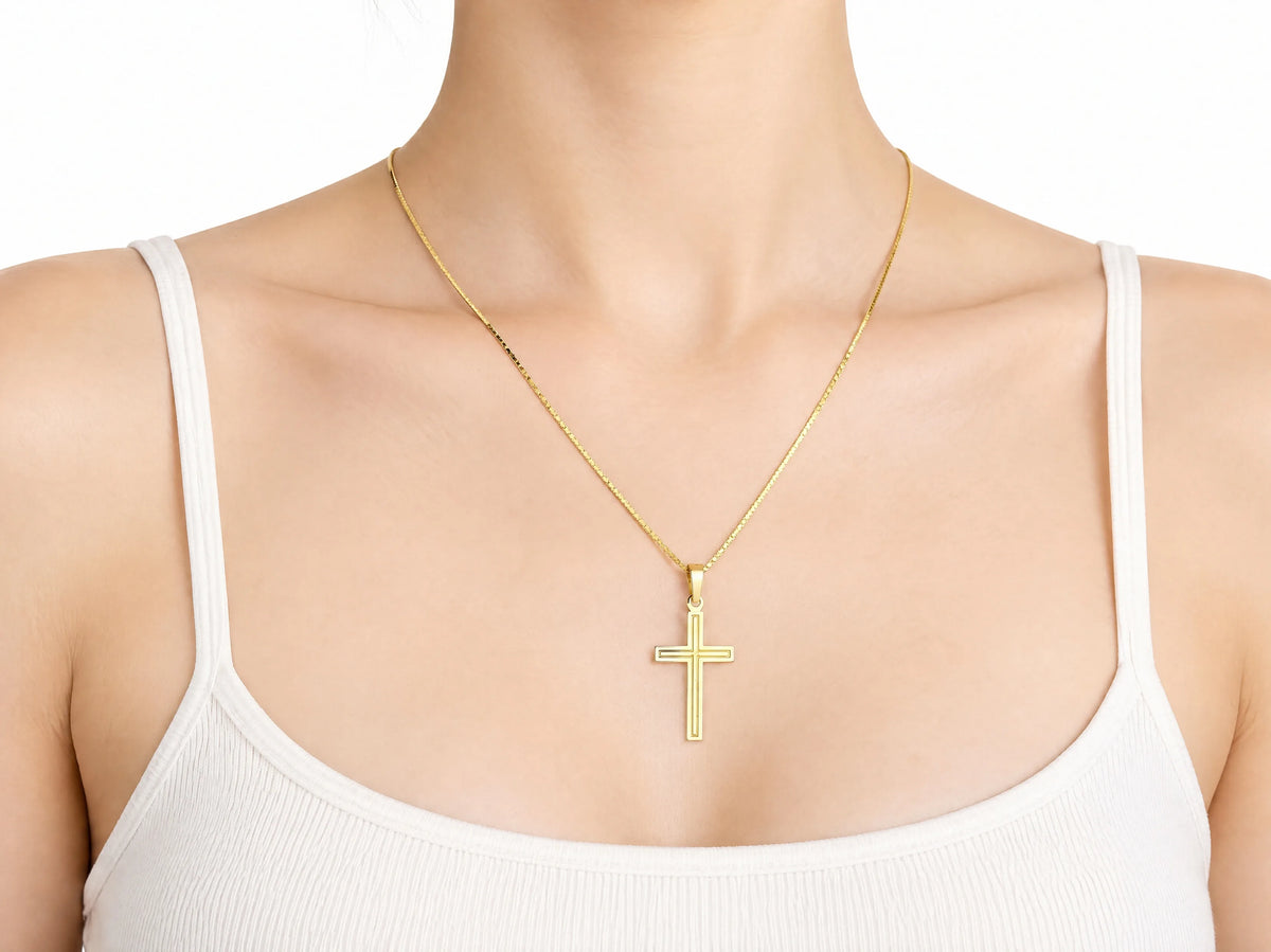 18K Gold Fluted Cross Pendant, M size, worn on a person showing the scale of the 17 x 25 mm cross